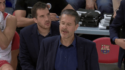 Man In Suit In Front Of Red FC Barcelona Seat GIF