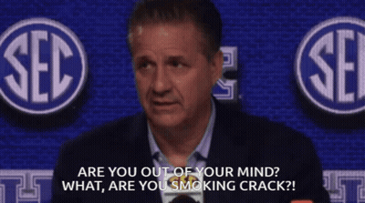 Man In Suit In Front Of SEC Logo GIF