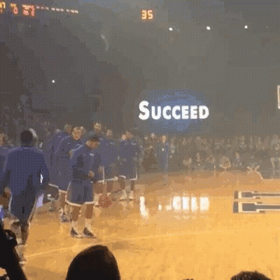 Man In Suit In Front Of SEC Logo GIF