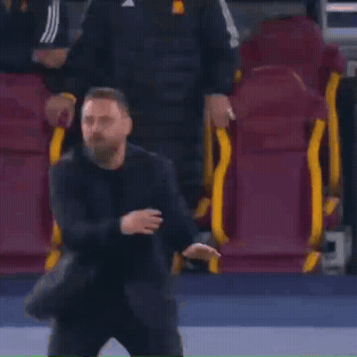 Man In Suit In Front Of Soccer Seats GIF