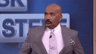 Man In Suit In Front Of Steve Harvey Logo GIF
