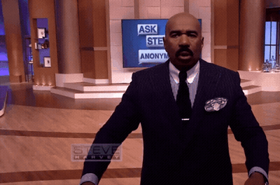Man in Suit in Front of Steve Harvey Screen