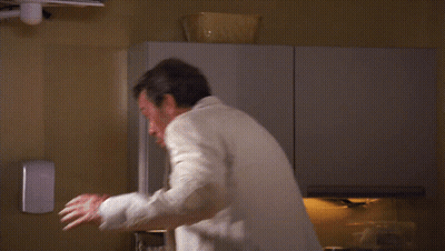 Man In Suit In Front Of That's A Sign GIF
