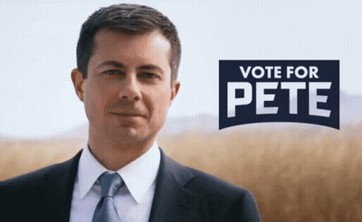 Man In Suit In Front Of Vote For Pete Sign GIF