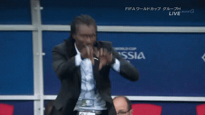 Man In Suit In Front Of Wall Saying Russia GIF