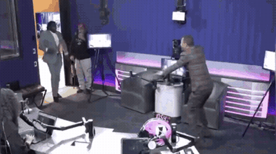 Man In Suit In Purple Room GIF