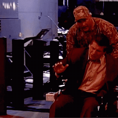 Man In Suit In Wheelchair With Man In Military Uniform GIF