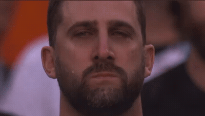 Man In Suit Jumping On Chair Beside Another Man GIF