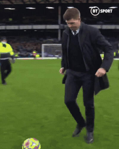 Man In Suit Kicking Soccer Ball GIF