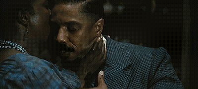 Man In Suit Kissing Woman GIF