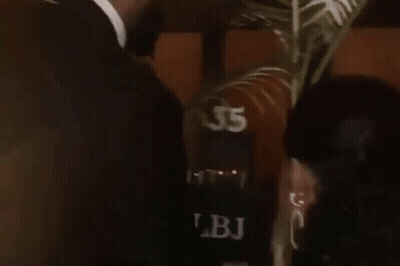 Man In Suit Kissing Woman GIF