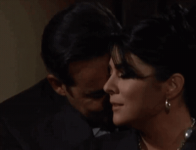 Man In Suit Kissing Woman GIF
