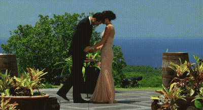 Man In Suit Kissing Woman's Forehead GIF