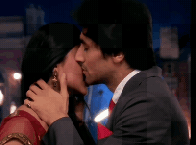 Man In Suit Kissing Woman GIF