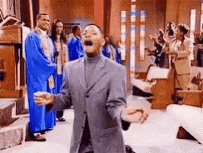 Man In Suit Kneeling Before Church Choir GIF