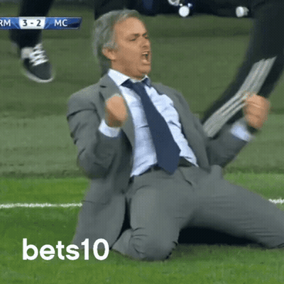 Man In Suit Kneeling On Field GIF