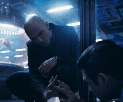 Man In Suit Kneeling Talking To Man GIF