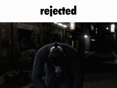 Man In Suit Kneeling With Word Rejected GIF