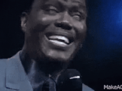 Man In Suit Laughing And Speaking GIF