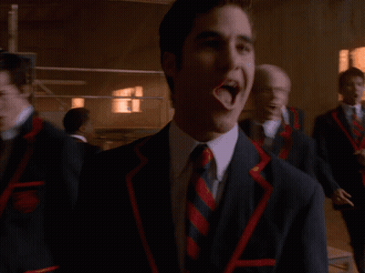 Man In Suit Laughing Beside Two Men GIF