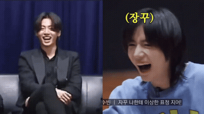 Man In Suit Laughing Next To Man In Blue Shirt GIF