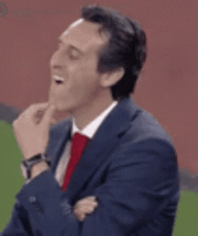 Man In Suit Laughing On Soccer Field GIF