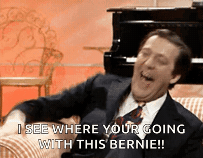 Man In Suit Laughing Saying I See Where You're Going With This Bernie GIF