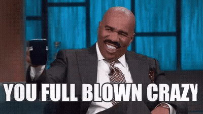 Man In Suit Laughing Saying You Full Blown Crazy GIF