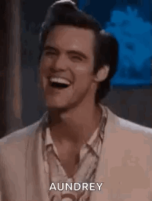 Man In Suit Laughing With Audrey GIF