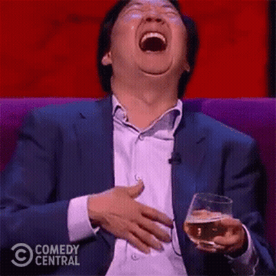 Man In Suit Laughing With Beer GIF