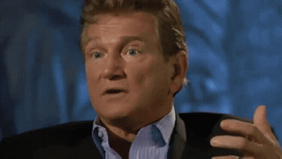 Man In Suit Laughing With Eyes Closed GIF