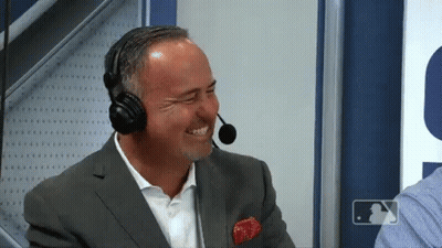Man In Suit Laughing With Headphones And Microphone GIF