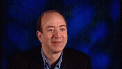 Man in Suit Laughing With Mouth Open