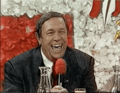 Man In Suit Laughing With Red Microphone GIF