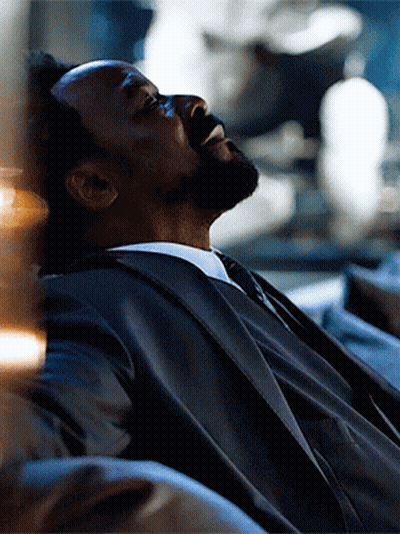 Man In Suit Laying On Couch Eyes Closed GIF