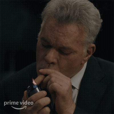 Man In Suit Lighting Cigarette With Prime Video Logo GIF