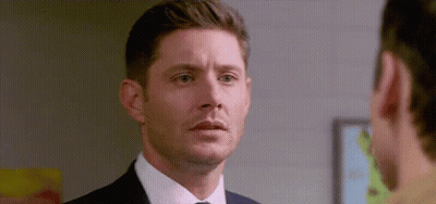 Man in Suit Looking at Another Man