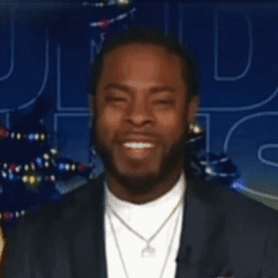 Man In Suit Looking At Camera With Letter D GIF