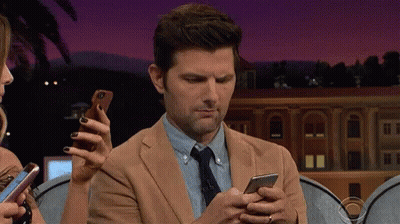 Man In Suit Looking At Cell Phone GIF