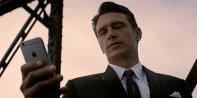 Man In Suit Looking At IPhone GIF