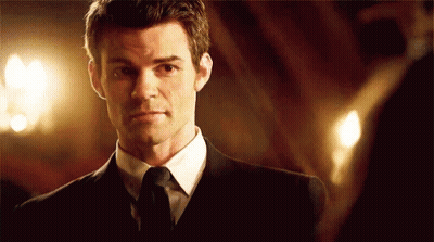 Man In Suit Looking At Mirror GIF