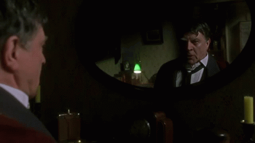 Man In Suit Looking At Mirror GIF