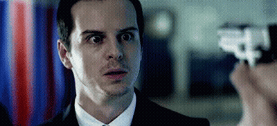 Man In Suit Looking At Person Holding Gun GIF