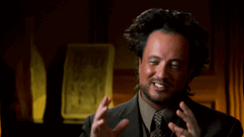 Man In Suit Looking At Phone GIF