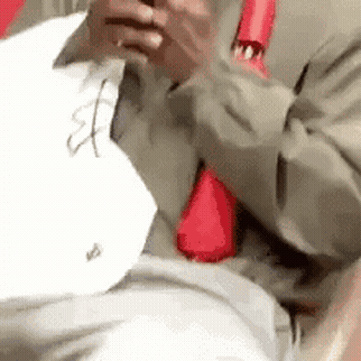 Man In Suit Looking At Phone GIF