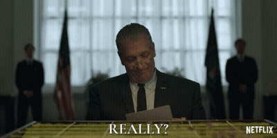 Man In Suit Looking At Really Paper GIF