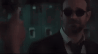 Man In Suit Looking At Screen GIF