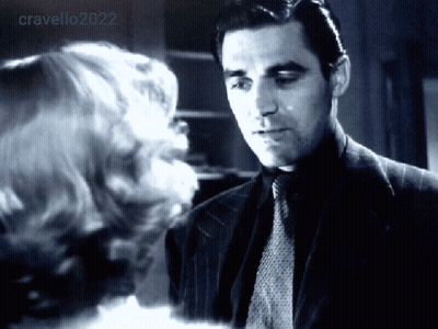 Man In Suit Looking At Woman In Black And White Photo GIF