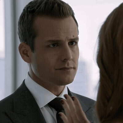 Man In Suit Looking At Woman's Hand GIF