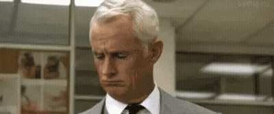 Man In Suit Looking Down GIF